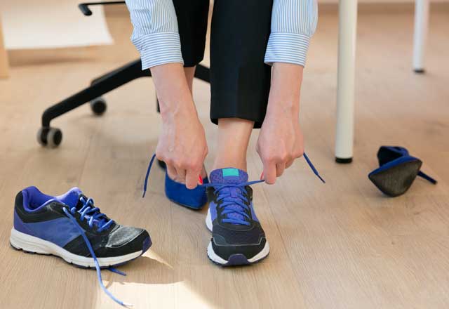 Employee changing into walking shoes